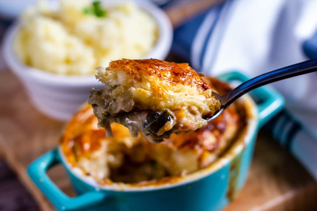 Spoon of slow cooked chicken pie