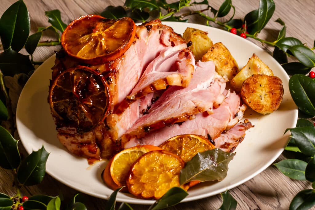 Slow Cooker Christmas Ham cooked with cranberry and orange.
