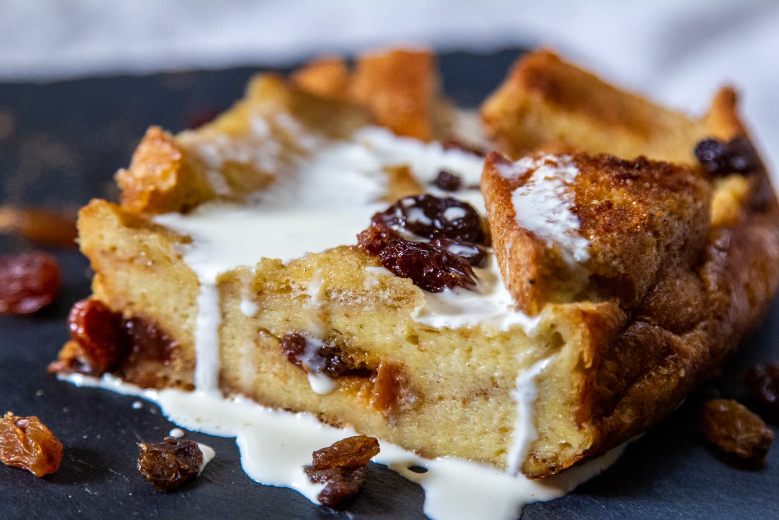 Close-up aerial view of slow-cooker bread pudding with currants scattered