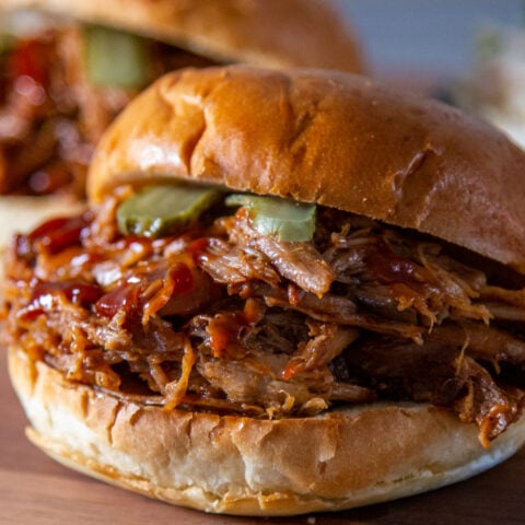 Slow cooker pulled pork with BBQ sauce in a bun.