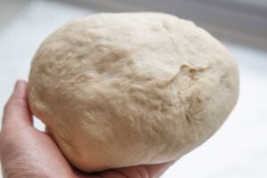 Image to show firm dough after kneading. Part of the process to make Slow Cooker Bread.