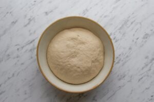 Image to show dough that has been proved for Slow Cooker Bread.