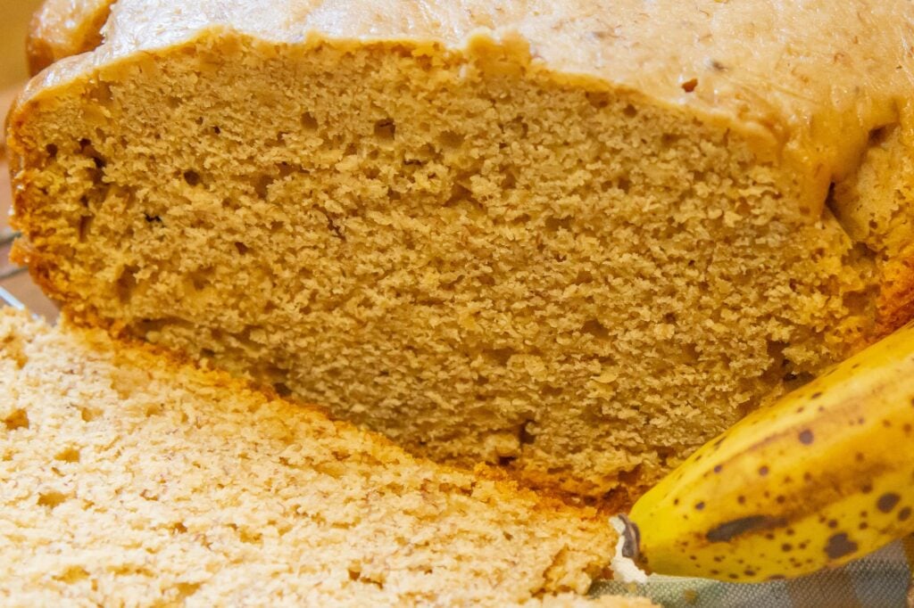 Close up image of a banana cake baked in the crockpot and sliced.