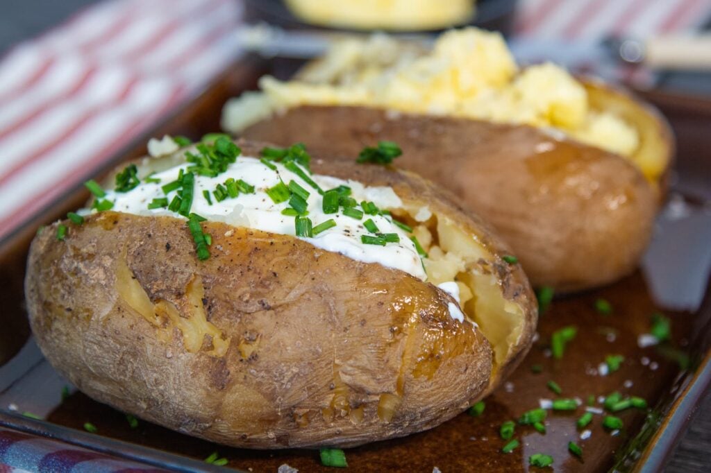 Slow cooker jacket potato with crispy skin and a filling of sour cream and chives.
